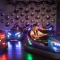 Girls having fun on bumper cars at Archie Brothers